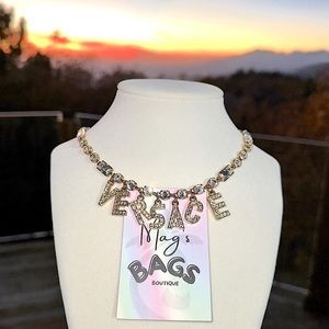 Versace: Crystal Logo Embellished Gold Necklace